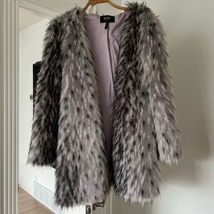 Cozy Faux fur mid thigh length BCBG coat.